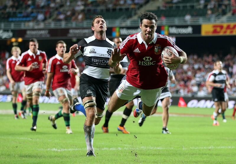 HONG KONG - JUNE 01:  Mike Phillips of the Lions dives over for his second try during the match between the British & Irish Lions and the Barbarians at Hong Kong Stadium on June 1, 2013,  Hong Kong.  (Photo by David Rogers/Getty Images) *** Local Caption ***  169759071.jpg