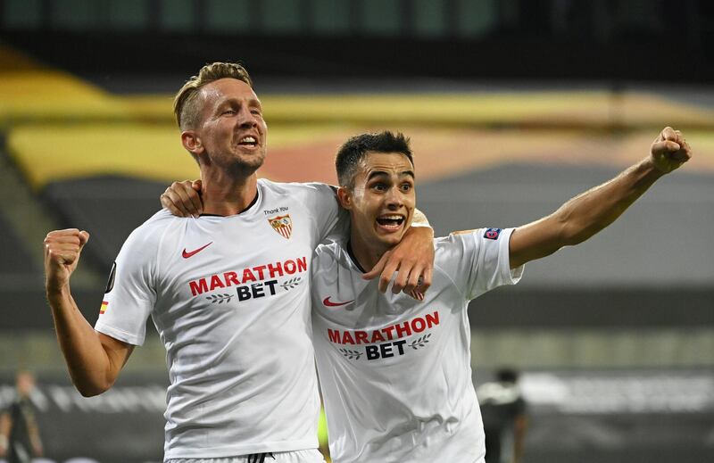 Sevilla's Luuk de Jong (L) celebrates scoring their second goal. Reuters