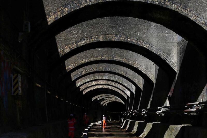 A worker walks out of the Connaught Tunnel section of the Crossrail project. Work is taking place to create a new platform and passenger tunnels for a new Crossrail station. Andrew Winning / Reuters