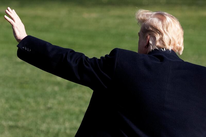epa07469660 US President Donald J. Trump waves to visitors on the South Lawn of the White House before departing by Marine One, in Washington, DC, USA, 28 March 2019. Trump travels to Grand Rapids, Michigan, to hold his first rally since Special Counsel Robert Mueller concluded his report on the investigation into Russian interference in the 2016 election.  EPA/MICHAEL REYNOLDS