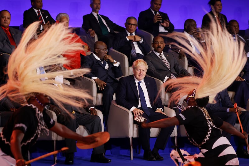 Mr Johnson watches a dance at the opening ceremony. Leaders of Commonwealth countries come together every two years for the meeting. Getty Images