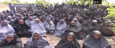 ***ATTENTION EDITORS - PICTURES SHOWING ABDUCTED MINORS CAN BE BLURED AT YOUR DISCRETION***
A screengrab taken on May 12, 2014, from a video of Nigerian Islamist extremist group Boko Haram obtained by AFP shows girls, wearing the full-length hijab and praying in an undisclosed rural location. Boko Haram released a new video on claiming to show the missing Nigerian schoolgirls, alleging they had converted to Islam and would not be released until all militant prisoners were freed.  A total of 276 girls were abducted on April 14 from the northeastern town of Chibok, in Borno state, which has a sizeable Christian community. Some 223 are still missing. AFP PHOTO / BOKO HARAM 
RESTRICTED TO EDITORIAL USE - MANDATORY CREDIT "AFP PHOTO / BOKO HARAM" - NO MARKETING NO ADVERTISING CAMPAIGNS - DISTRIBUTED AS A SERVICE TO CLIENTS (Photo by HO / BOKO HARAM / AFP)