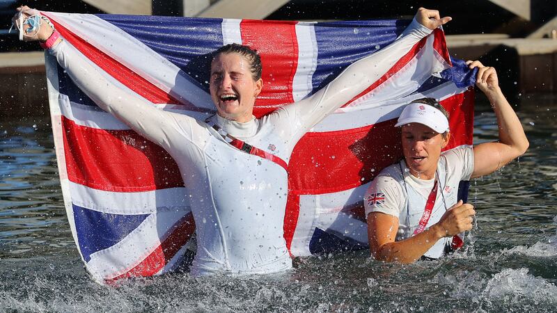 Hannah Mills of Britain and Eilidh McIntyre of Britain celebrate winning gold in the women's 470 sailing final.