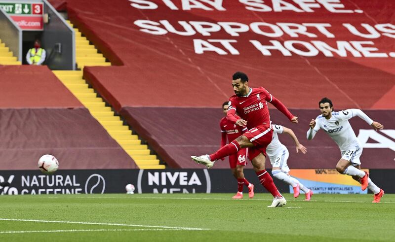 LIVERPOOL, ENGLAND - SEPTEMBER 12: Mohamed Salah of Liverpool scores a penalty for his team's first goal during the Premier League match between Liverpool and Leeds United at Anfield on September 12, 2020 in Liverpool, England. (Photo by Paul Ellis - Pool/Getty Images)