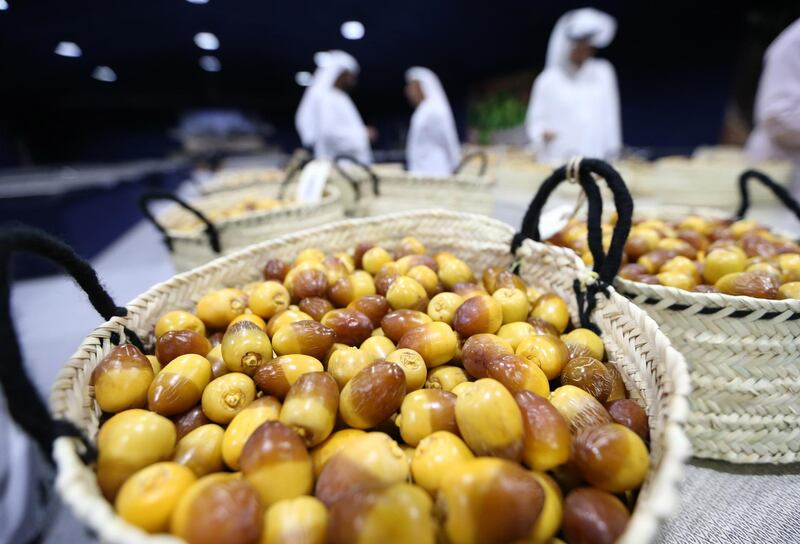 Baskets of dates are laid out for judging as part of the Al Dabbas competition on the first day of the Liwa Dates Festival. EPA