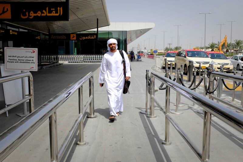 Dubai, United Arab Emirates - August 01 2013 - National reporter Thamer Al Subaihi walks to find a taxi after arriving on the new Rotana Jet at Dubai International Airport. The jet operates as a commuter flight daily between Abu Dhabi and Dubai. Four National reporters raced from Abu Dhabi to Dubai using various modes of transport to see which vehicle took the least time between two cities.  (Razan Alzayani / The National) 