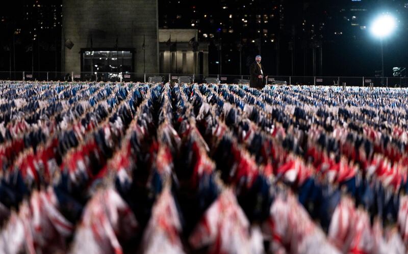 A person looks over the public art display 'Field of Flags', made up of over 200,000 flags intended to represent the American people who are unable to attend the upcoming presidential inauguration.  EPA