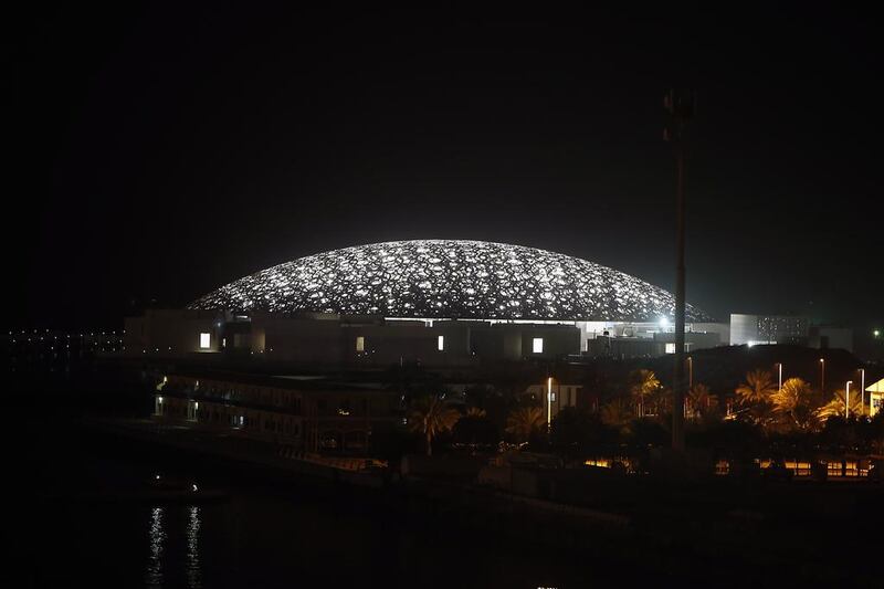 The Louvre Abu Dhabi construction site lights up the night on  Saadiyat Island. Ravindranath K / The National