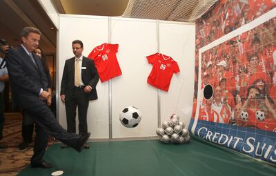 Riad Salameh, kicks a football at the Credit Suisse stand during the opening of the InterArab Cambist Association Congress in Beirut in 2009. Reuters