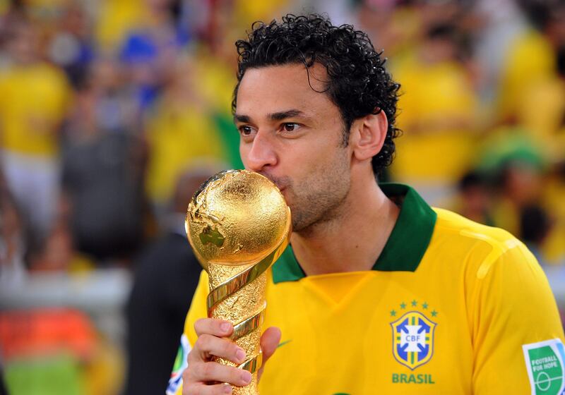 RIO DE JANEIRO, BRAZIL - JUNE 30:  Fred of Brazil celebrates with trophy after victory in the FIFA Confederations Cup Brazil 2013 Final match between Brazil and Spain at Maracana on June 30, 2013 in Rio de Janeiro, Brazil.  (Photo by Michael Regan/Getty Images) *** Local Caption ***  172029093.jpg