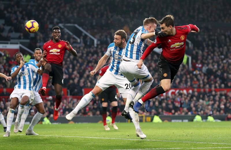 Manchester United's Victor Lindelof heads the ball. PA via AP