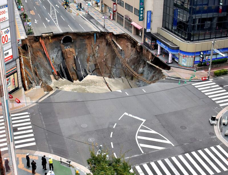 A huge sinkhole at a junction in Fukuoka, Japan. Workers managed to fill it up in a few days in 2016. Reuters