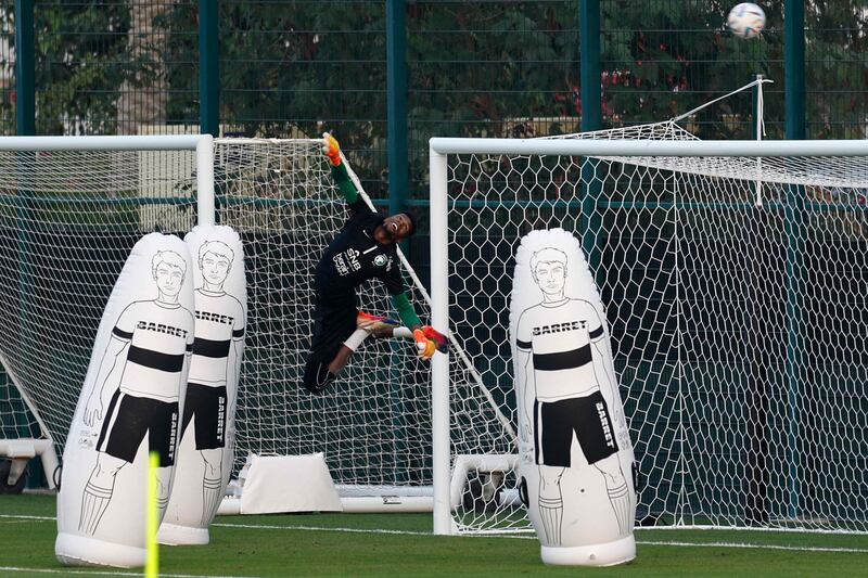 Saudi Arabia goalkeeper Mohammed Al-Yami makes an acrobatic save during a training session. AFP