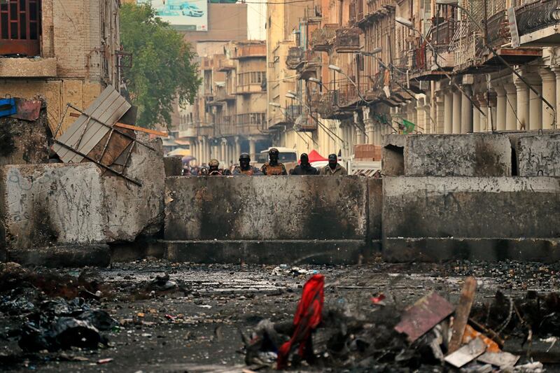 Security forces close Rasheed Street during ongoing anti-government protests in Baghdad. AP Photo