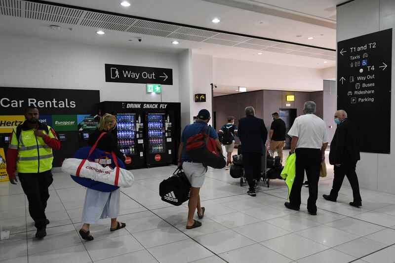 Passengers arriving from Sydney depart Melbourne Airport.  EPA