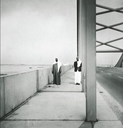 Sheikh Zayed prepares to pray on the Maqta Bridge, accompanied by one of his most trusted advisers, Ahmed Al Suwaidi