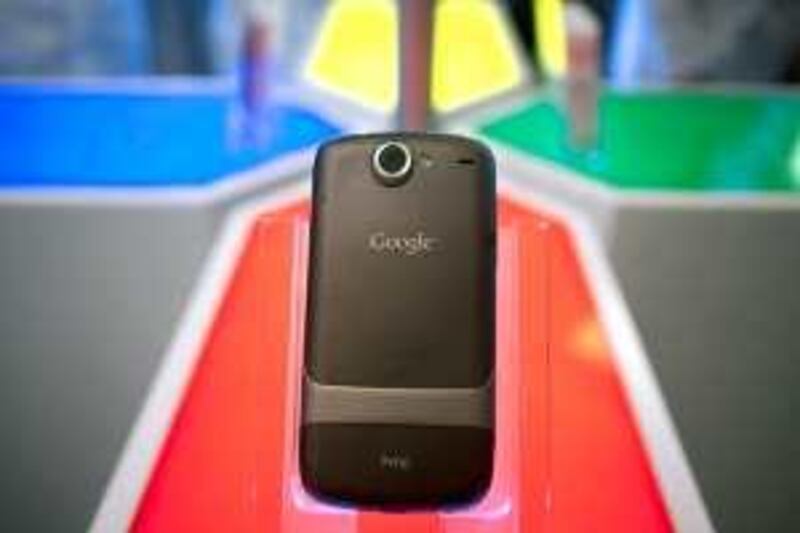 A Google Inc. Nexus One touch-screen mobile phone sits on display for the media at Google headquarters in Mountain View, California, U.S., on Tuesday, Jan. 5, 2010. Google Inc., aiming to take on Apple Inc.'s iPhone and defend its dominance in Internet search, introduced a touch-screen mobile phone called Nexus One that runs on its own Android operating system. Photographer: Kim White/Bloomberg