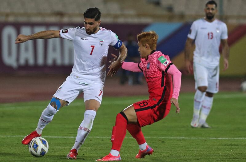 Iran midfielder Alireza Jahanbakhsh (L) is marked by South Korea's Moon Seon-min. AFP