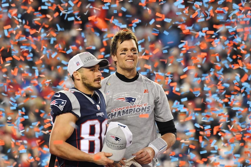 Jan 21, 2018; Foxborough, MA, USA; New England Patriots quarterback Tom Brady (right) and wide receiver Danny Amendola (80) celebrate as confetti flies after the AFC Championship Game against the Jacksonville Jaguars at Gillette Stadium. Mandatory Credit: Robert Deutsch-USA TODAY Sports