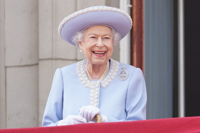Queen Elizabeth II watches from the balcony of Buckingham Palace during the Trooping the Colour parade in 2022. All photos: Getty Images