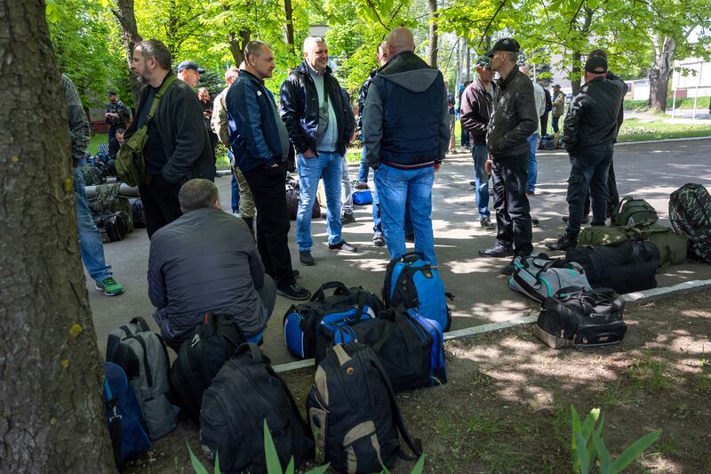 Men report to enlist in Ukrainian Territorial Defence Force units in Kryvyi Rih, Ukraine. Getty Images