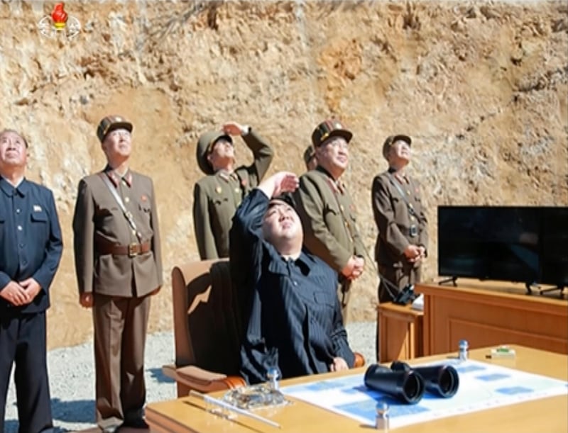 This image made from video of a news bulletin aired by North Korea on July 4, 2017, shows North Korea leader Kim Jong-un (C) watching the launch of a Hwasong-14 intercontinental ballistic missile. KRT / AP Video