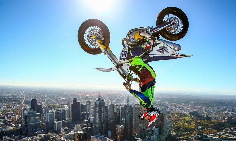 World Champion Trials bike rider Jack Field of Australia performs the highest backflip on a motorcycle ever recorded as he flips his motorbike upside down on the roof of Melbourne's Eureka Tower during a AUS-X Open media opportunity at Eureka Tower in Melbourne, Australia.  Getty