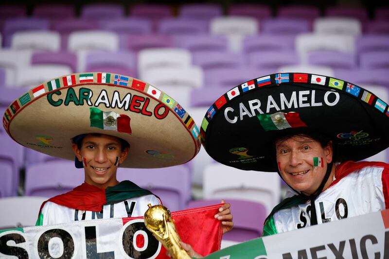 Guadalajara's supporters smile ahead of the match. AP Photo