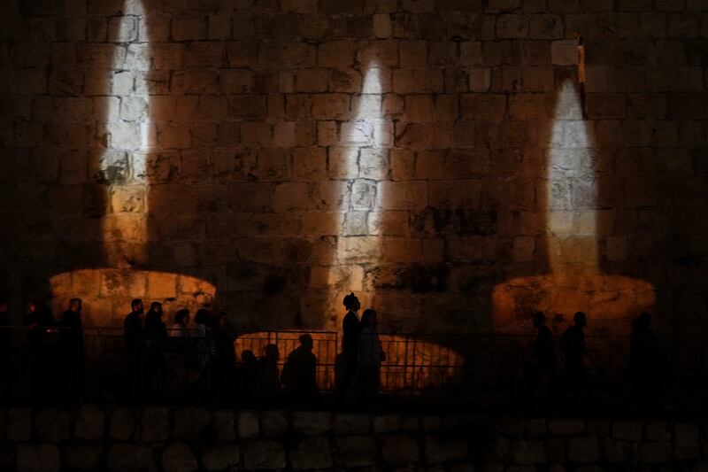 Images of memorial candles projected on the walls of Jerusalem's Old City on the eve of Holocaust Remembrance Day. AP
