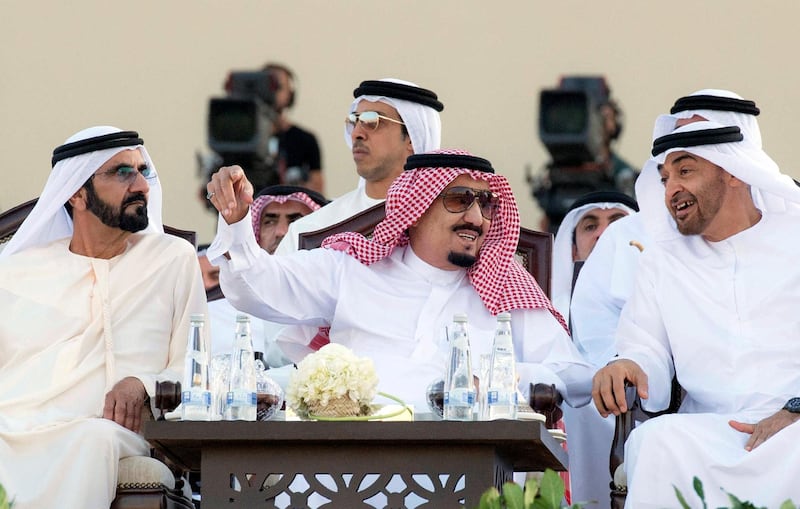 A handout picture provided by the Saudi Royal Palace on December 4, 2016 shows Saudi King Salman (C) sitting between UAE Prime Minister Sheikh Mohammed bin Rashid al-Maktoum (L) and Crown Prince of Abu Dhabi, Sheikh Mohamed bin Zayed al-Nahyan (R)during a ceremony in Abu Dhabi. - King Salman is on a regional tour that will take him to the UAE, Qatar, Bahrain and Kuwait. (Photo by BANDAR AL-JALOUD / Saudi Royal Palace / AFP) / RESTRICTED TO EDITORIAL USE - MANDATORY CREDIT "AFP PHOTO / SAUDI ROYAL PALACE / BANDAR AL-JALOUD" - NO MARKETING NO ADVERTISING CAMPAIGNS - DISTRIBUTED AS A SERVICE TO CLIENTS