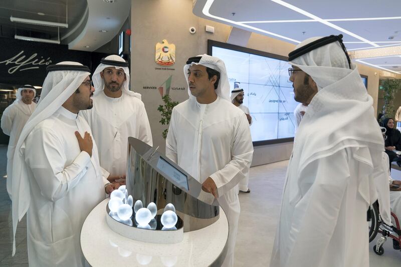 DUBAI, UNITED ARAB EMIRATES - September 17, 2017: HH Sheikh Mansour bin Zayed Al Nahyan, UAE Deputy Prime Minister and Minister of Presidential Affairs (2nd R) and HE Mohamed Mubarak Al Mazrouei, Undersecretary of the Crown Prince Court of Abu Dhabi (3rd R), visit Government Accelerators headquarters.

( Mohamed Al Hammadi / Crown Prince Court - Abu Dhabi )
---