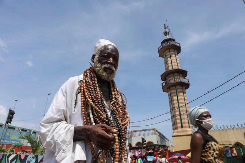 A man walks near the mosque of Adjame during the holy month in Abidjan, Ivory Coast. Reuters