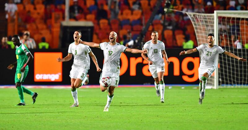 A despondent Mane leaves the field as Algeria celebrate. AFP