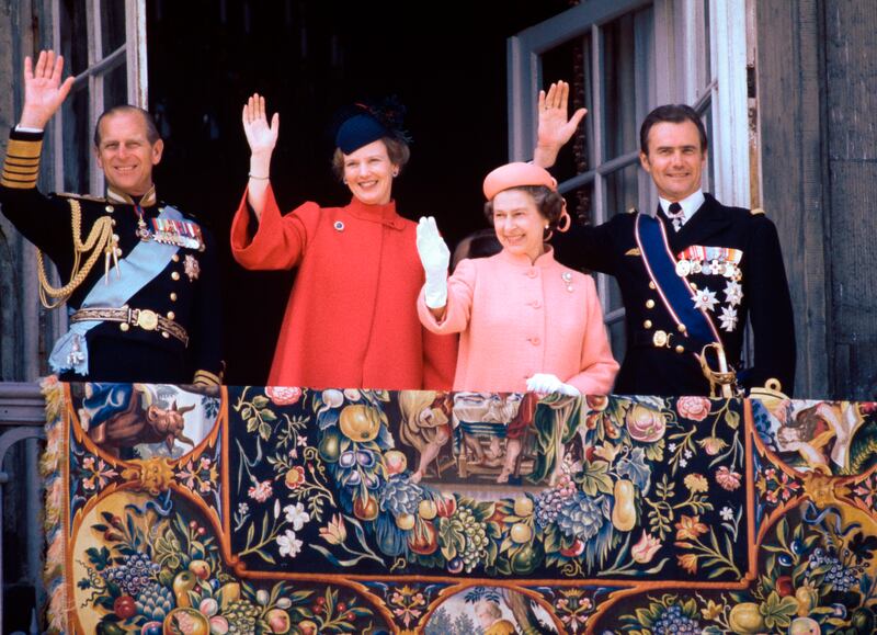 Britain's Prince Philip, Queen Margrethe, Queen Elizabeth II and Prince Henrik wave from the balcony of Amalienborg Castle during the British royal couple's visit in 1979. EPA