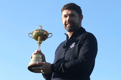Padraig Harrington holds the Ryder Cup for the media at the Wentworth Golf Club, south England, Tuesday Jan. 8, 2019. Padraig Harrington has been chosen as captain of the Europe team for the 2020 Ryder Cup at Whistling Straits, it was announced by the European Tour at its headquarters at Wentworth. (Adam Davy/PA via AP)