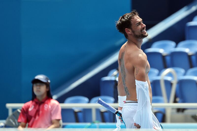 Italy's Fabio Fognini reacts as he competes against Russia's Daniil Medvedev.
