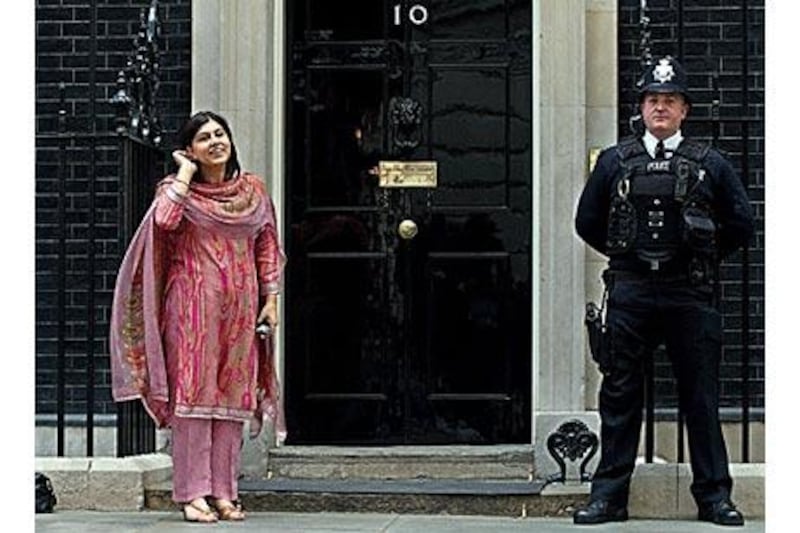 Baroness Warsi described her rise from a working-class childhood to government offices as "humbling".