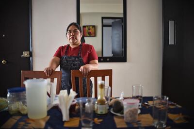 Mexican domestic worker Ignacia Ponciano poses at the house where she has worked for over 30 years in Mexico City on January 18, 2019. The working conditions of domestics in Latin America, to whom director Alfonso Cuaron pays homage in his recent movie 'Roma', is slowly reaching a legal framework. Whilst several countries in the region have established laws for the sector in the last decade, other simultaneous realities such as economic crises and migration, are hampering those conquests and ambitions of formality. / AFP / Rodrigo ARANGUA

