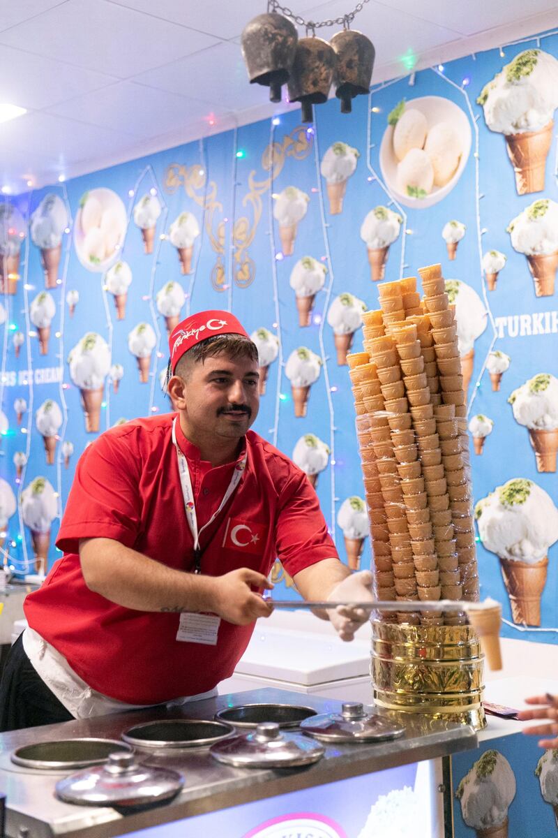 DUBAI, UNITED ARAB EMIRATES - OCTOBER 30, 2018. 

Turkish icecream vendor in the Turkish village.

Global Village opened it's gates today to the public for its 23rd season.

(Photo by Reem Mohammed/The National)

Reporter: PATRICK RYAN
Section:  NA