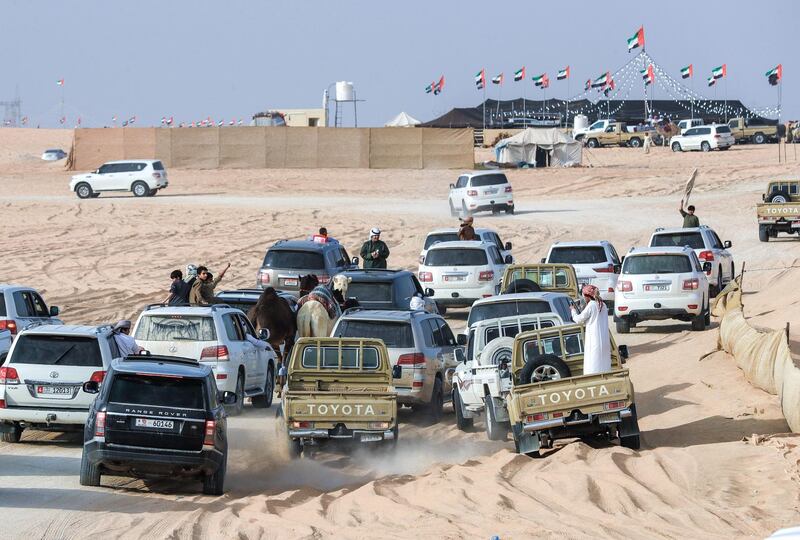 Abu Dhabi, United Arab Emirates, December 10, 2019.  
  Al Dhafra Festival 2019.
--Winners of the two year old camel contest during the parade.
Victor Besa/The National
Section:  NA
Reporter:  Anna Zacharias