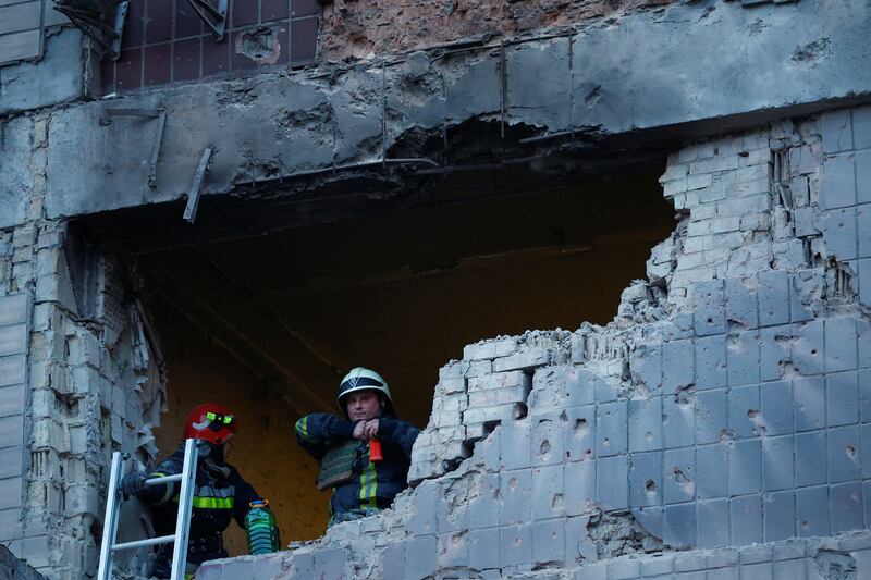 Rescuers at a Kyiv building damaged during the Russian drone strike. Reuters