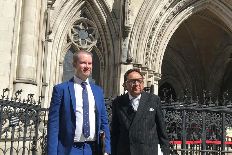 Lord Sheikh, right, with his solicitor Callum Galbraith, outside the Royal Courts of Justice in London, after the publisher of the MailOnline agreed to pay "substantial" damages to settle his libel claim over "highly defamatory allegations" about his attendance at a conference on Palestinian rights, Thursday July 30, 2020. ( Sam Tobn/PA via AP)