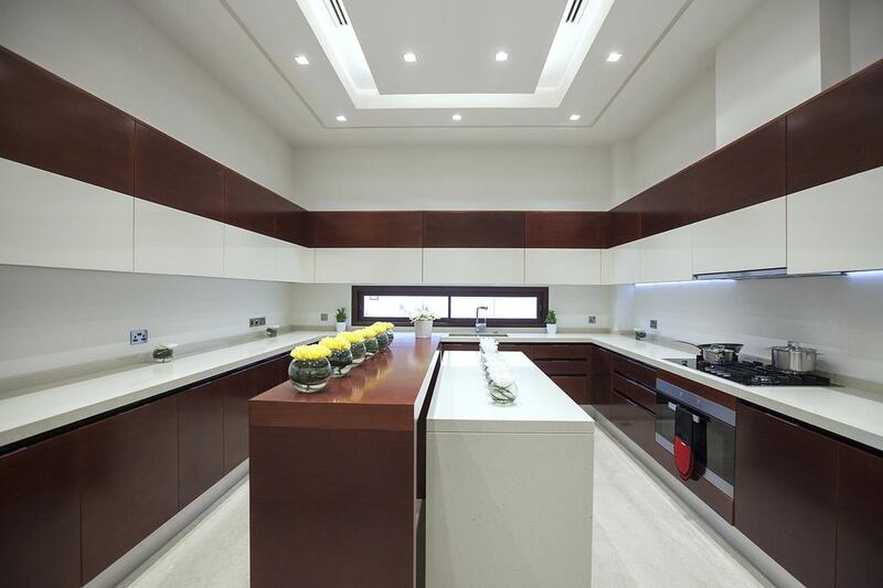 The main kitchen in type 3C. Villas come with separate indoor and outdoor kitchens, a driver’s room, a formal majlis big enough to play a game of five-a-side football and a separate family living space. Mona Al Marzooqi / The National