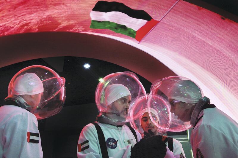 DUBAI, UNITED ARAB EMIRATES - - -  March 1, 2016 --- Salman Sadiq, 20; (from left), Munzir Saifullah, 20; Yousef Ibrahim, 20 and Craig Creado, 20, promote the new UAE space program as they walk around in astronaut gear during the Global Educational Supplies & Solutions (GESS) in Dubai on opening day, March 1, 2016.  They are students at Emirates Aviation in Dubai.   ( DELORES JOHNSON / The National )
ID: 44836
Reporter: Nadeem Hanif
Section: NA *** Local Caption ***  DJ-010316-NA-Educationa Technology-44836-001.jpg