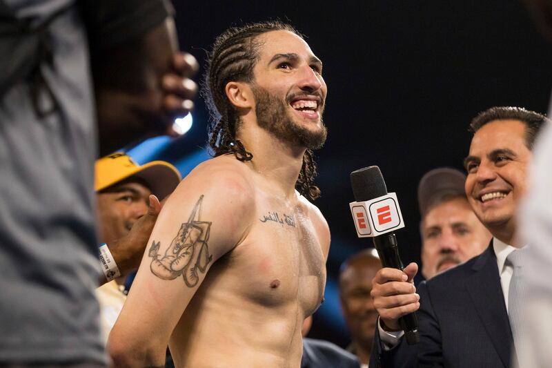 Nico Ali Walsh smiles during an interview after he defeated Jordan Weeks during a middleweight boxing bout Saturday, Aug.  14, 2021, near Tulsa, Okla.  (Brett Rojo / Tulsa World via AP)