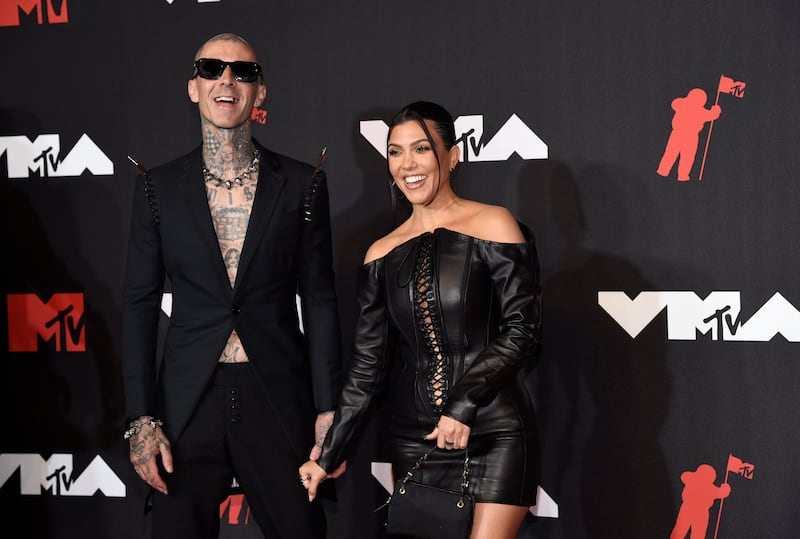Travis Barker and Kourtney Kardashian arrive at the MTV Video Music Awards in New York. The couple announced their engagement this year. Invision / AP