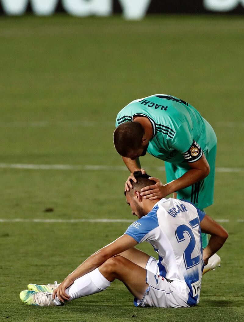Leganes' Oscar is consoled by Real Madrid's Nacho. EPA