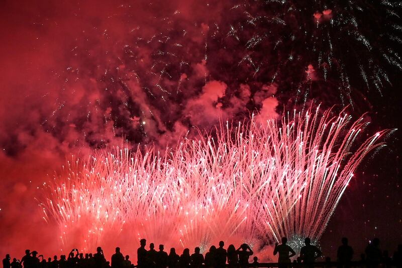 People watch fireworks exploding above the new 269-hectare land of the Colombo Port City, added as an extension to the Colombo Central Business District and being officially part of Sri Lanka, in Colombo.  AFP