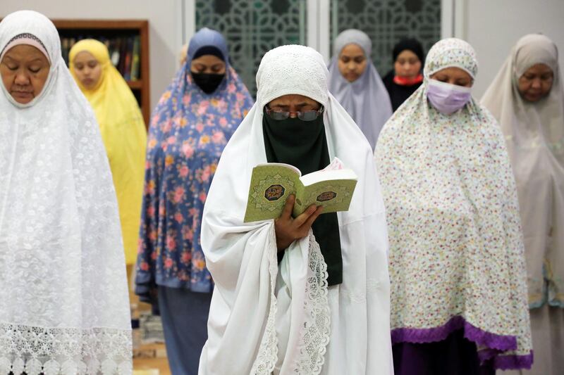 Women at prayer in Kuala Lumpur, Malaysia. Reuters