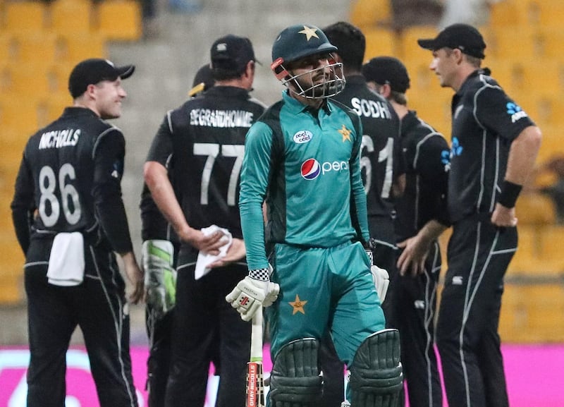 Pakistan's batsman Shadab Khan walks back to the pavilion after his dismissal during the first one day international (ODI) cricket match between Pakistan and New Zealand at the Sheikh Zayed Cricket Stadium in Abu Dhabi on November 7, 2018. / AFP / KARIM SAHIB
